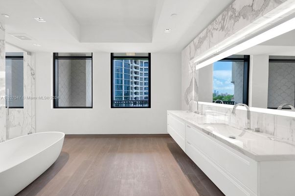 Bathroom, Dual Sink Vanities, Free Standing Baths, Interior, Marble Walls, Recessed Lighting, Wood Texture Flooring