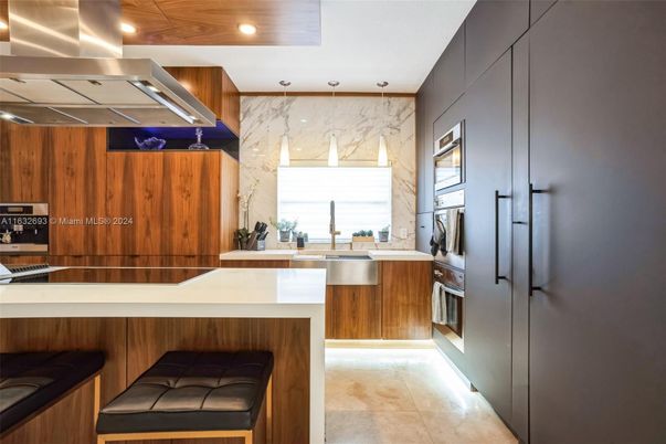 Interior, Kitchen, Marble Walls, Recessed Lighting, Stainless Steel Appliances