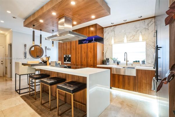 Interior, Kitchen, Marble Walls, Pendant Lights, Recessed Lighting, Stainless Steel Appliances