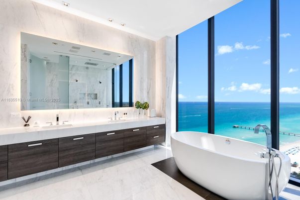 Bathroom, Dual Sink Vanities, Free Standing Baths, Glass Shower, Interior, Marble, Marble Walls, Recessed Lighting, Water