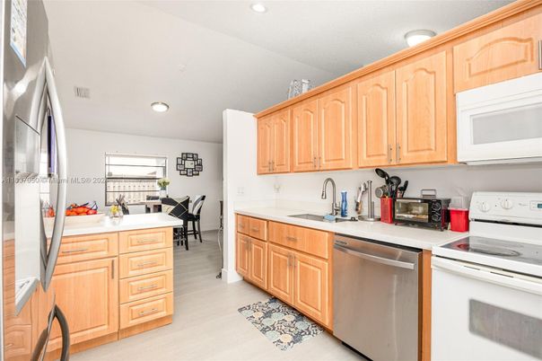 Dining room, Interior, Kitchen, Recessed Lighting, Stainless Steel Appliances, Wood Texture Flooring