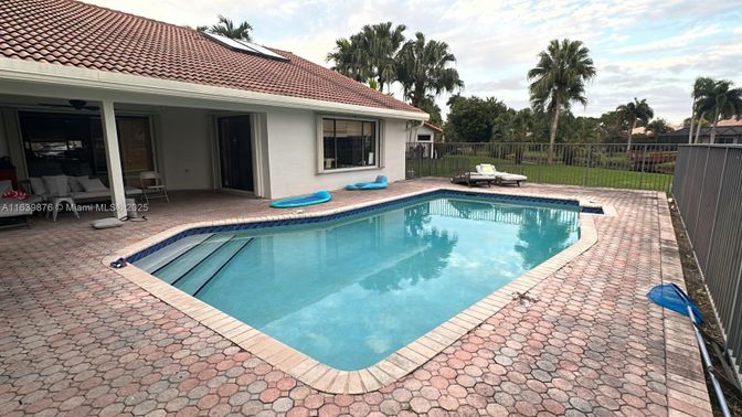 Exterior, Pool, Solar Panels