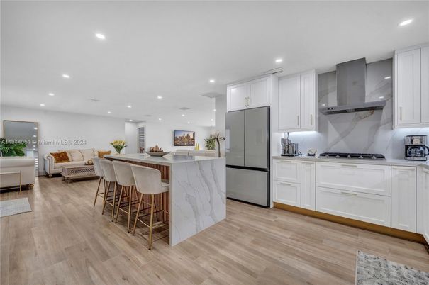 Interior, Kitchen, Living room, Marble Walls, Recessed Lighting, Stainless Steel Appliances, Wood Texture Flooring