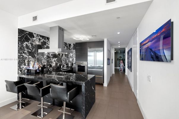 Interior, Kitchen, Marble Walls, Recessed Lighting, Stainless Steel Appliances