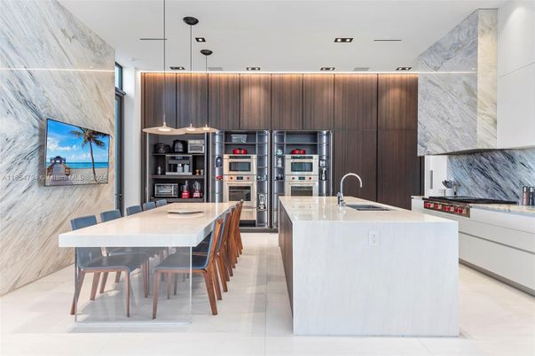 Interior, Kitchen, Marble Walls, Pendant Lights, Recessed Lighting, Stainless Steel Appliances