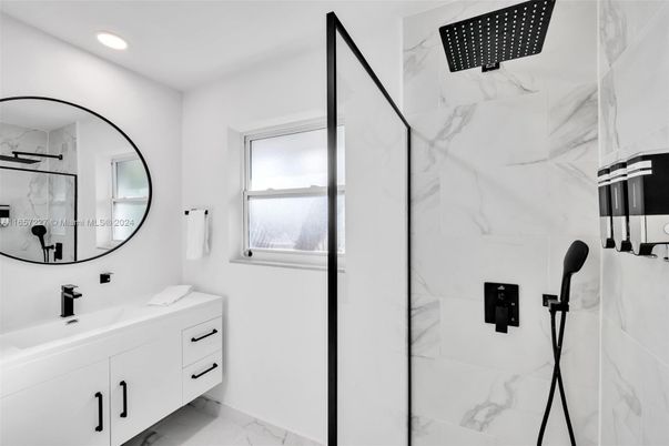 Bathroom, Dual Sink Vanities, Glass Shower, Interior, Marble, Marble Walls, Recessed Lighting