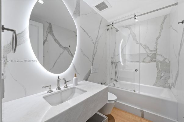 Bathroom, Glass Shower, Interior, Marble Walls, Wood Texture Flooring