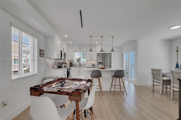 Dining room, Interior, Kitchen, Pendant Lights, Recessed Lighting, Stainless Steel Appliances, Wood Texture Flooring