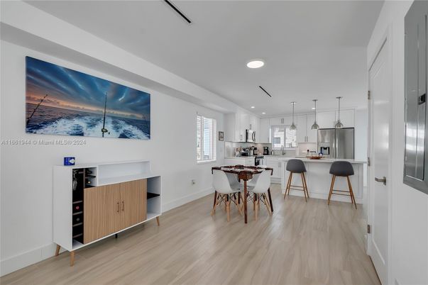 Dining room, Interior, Kitchen, Pendant Lights, Recessed Lighting, Stainless Steel Appliances, Wood Texture Flooring