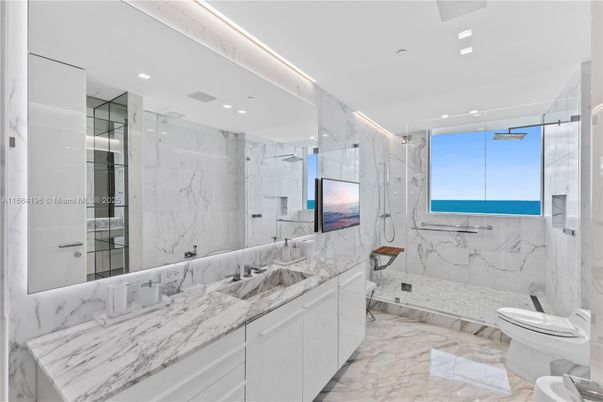 Bathroom, Dual Sink Vanities, Glass Shower, Interior, Marble, Marble Walls, Recessed Lighting, Water