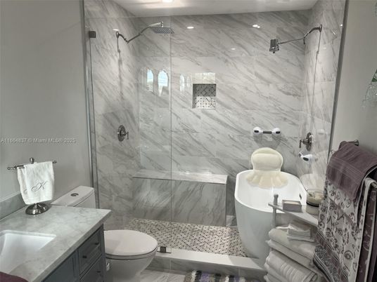 Bathroom, Free Standing Baths, Glass Shower, Interior, Marble, Marble Walls, Recessed Lighting