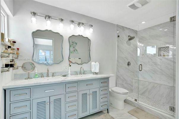 Bathroom, Dual Sink Vanities, Glass Shower, Interior, Marble Walls, Recessed Lighting