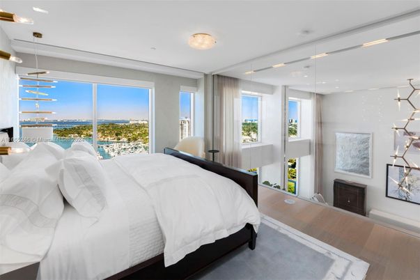 Bedroom, Fireplace, Interior, Pendant Lights, Recessed Lighting, Water, Wood Texture Flooring