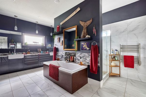 Bathroom, Dual Sink Vanities, Glass Shower, Interior, Marble, Marble Walls, Pendant Lights, Recessed Lighting