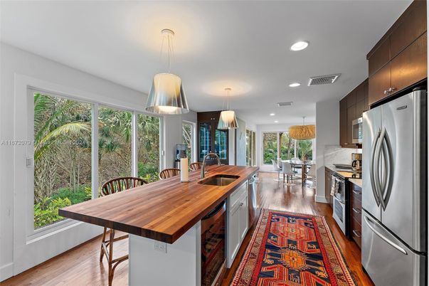 Dining room, Interior, Kitchen, Pendant Lights, Recessed Lighting, Stainless Steel Appliances, Wood Texture Flooring