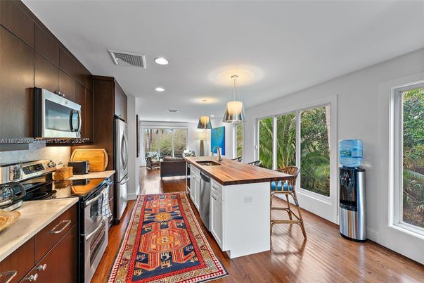 Dining room, Interior, Kitchen, Pendant Lights, Recessed Lighting, Stainless Steel Appliances, Wood Texture Flooring
