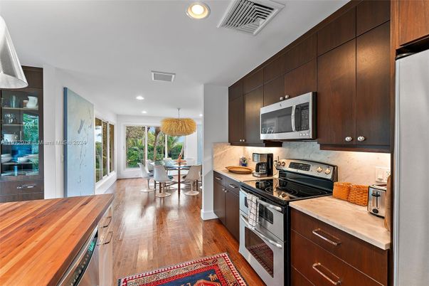 Dining room, Interior, Kitchen, Recessed Lighting, Stainless Steel Appliances, Wood Texture Flooring