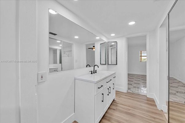 Bathroom, Dual Sink Vanities, Interior, Recessed Lighting, Wood Texture Flooring