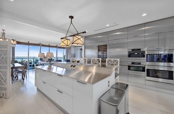 Chandelier, Dining room, Interior, Kitchen, Pendant Lights, Recessed Lighting, Stainless Steel Appliances, Wood Texture Flooring