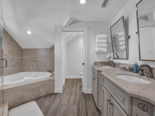 Bathroom, Dual Sink Vanities, Interior, Recessed Lighting, Wood Texture Flooring