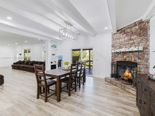 Dining room, Fireplace, Interior, Living room, Pendant Lights, Recessed Lighting, Stone Walls, Wood Texture Flooring
