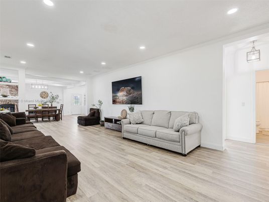 Dining room, Fireplace, Interior, Living room, Pendant Lights, Recessed Lighting, Wood Texture Flooring