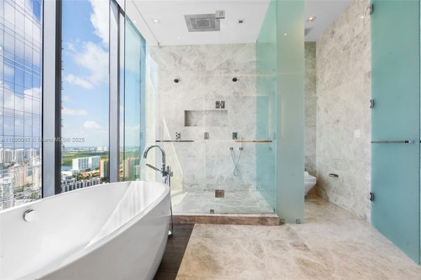 Bathroom, Free Standing Baths, Glass Shower, Interior, Marble Walls, Recessed Lighting