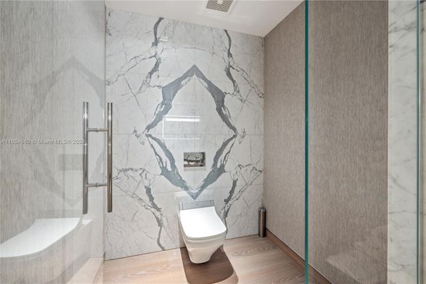 Bathroom, Glass Shower, Interior, Marble Walls, Wood Texture Flooring