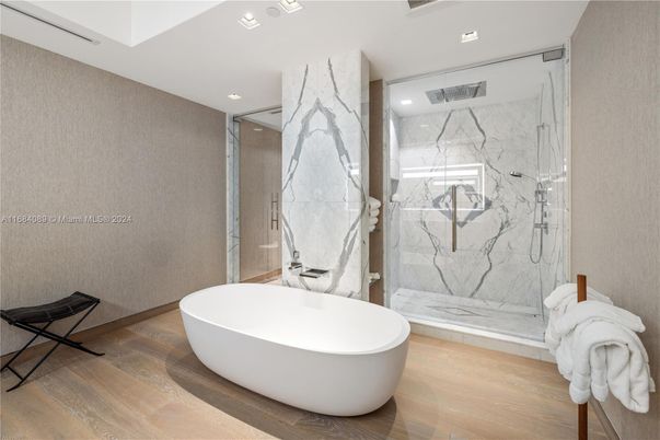 Bathroom, Free Standing Baths, Glass Shower, Interior, Marble Walls, Recessed Lighting, Wood Texture Flooring