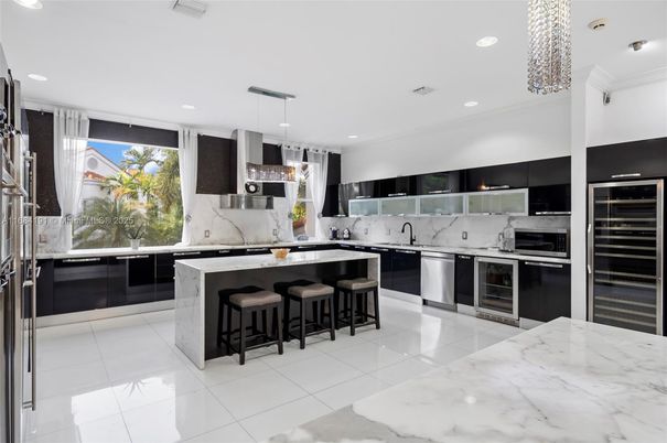 Interior, Kitchen, Marble Walls, Pendant Lights, Recessed Lighting, Stainless Steel Appliances