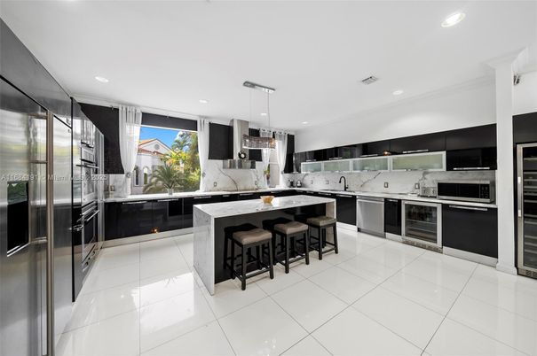 Interior, Kitchen, Marble Walls, Pendant Lights, Recessed Lighting, Stainless Steel Appliances