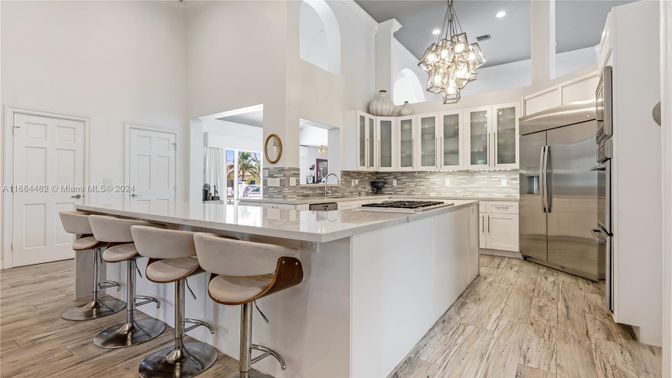 Chandelier, Interior, Kitchen, Pendant Lights, Recessed Lighting, Stainless Steel Appliances, Wood Texture Flooring
