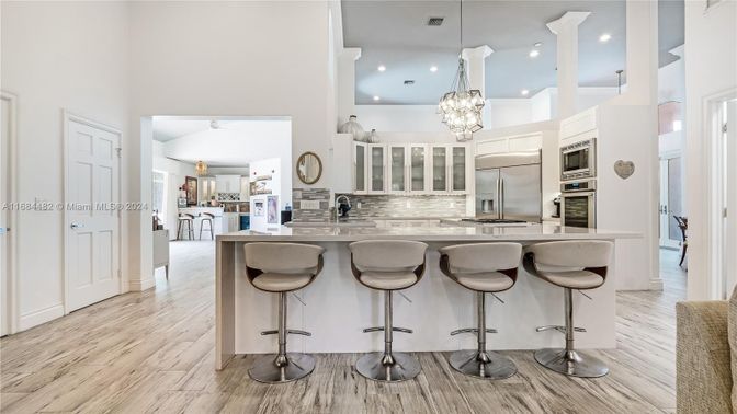 Chandelier, Interior, Kitchen, Pendant Lights, Recessed Lighting, Stainless Steel Appliances, Wood Texture Flooring