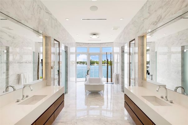 Bathroom, Dual Sink Vanities, Free Standing Baths, Glass Shower, Interior, Marble, Marble Walls, Recessed Lighting, Water