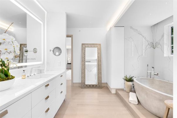 Bathroom, Dual Sink Vanities, Free Standing Baths, Interior, Marble Walls, Recessed Lighting, Wood Texture Flooring