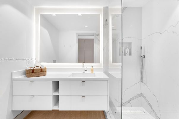 Bathroom, Dual Sink Vanities, Glass Shower, Interior, Marble Walls, Wood Texture Flooring