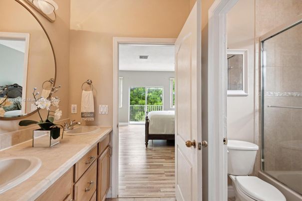 Bathroom, Bedroom, Dual Sink Vanities, Glass Shower, Interior, Tile Countertops, Wood Texture Flooring