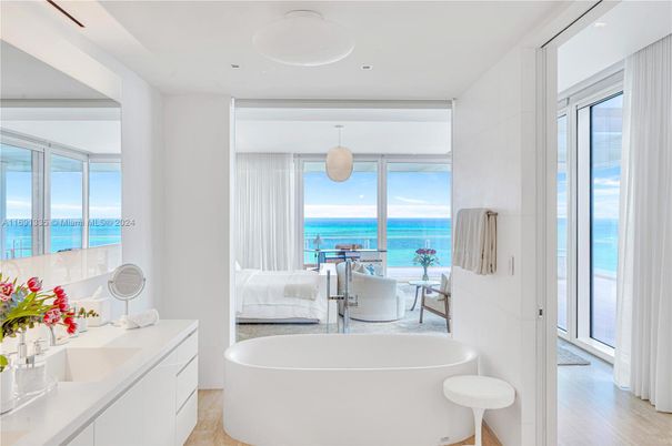 Bathroom, Bedroom, Free Standing Baths, Interior, Pendant Lights, Recessed Lighting, Water, Wood Texture Flooring