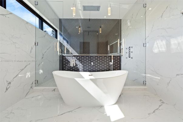 Bathroom, Free Standing Baths, Glass Shower, Interior, Marble, Marble Walls, Recessed Lighting