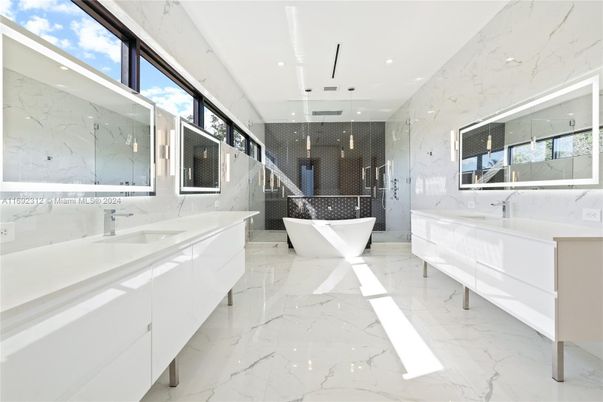 Bathroom, Dual Sink Vanities, Free Standing Baths, Glass Shower, Interior, Marble, Marble Walls, Pendant Lights, Recessed Lighting