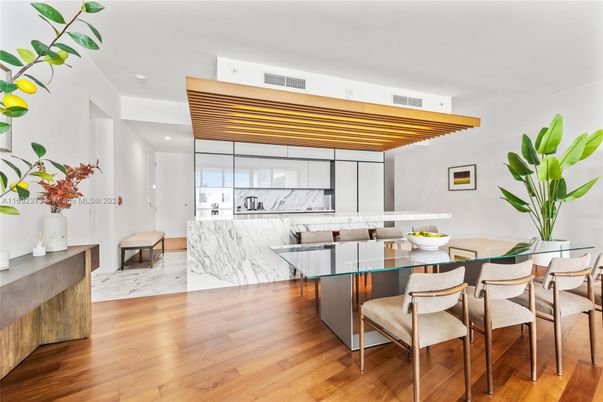 Dining room, Interior, Kitchen, Marble, Marble Walls, Pendant Lights, Recessed Lighting, Wood Texture Flooring