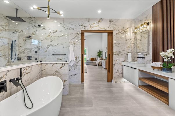 Bathroom, Dual Sink Vanities, Free Standing Baths, Glass Shower, Interior, Marble Walls, Recessed Lighting