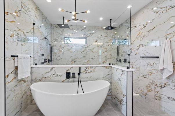 Bathroom, Free Standing Baths, Glass Shower, Interior, Marble, Marble Walls, Pendant Lights, Recessed Lighting