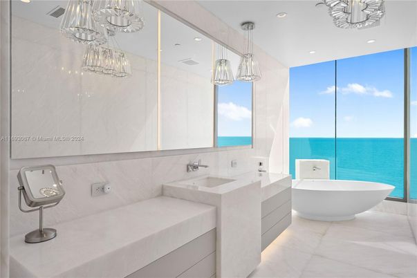 Bathroom, Dual Sink Vanities, Free Standing Baths, Interior, Marble, Marble Walls, Pendant Lights, Recessed Lighting, Water