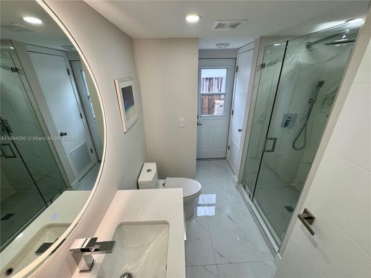 Bathroom, Dual Sink Vanities, Glass Shower, Interior, Marble, Marble Walls, Recessed Lighting