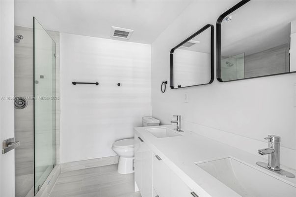 Bathroom, Dual Sink Vanities, Glass Shower, Interior, Wood Texture Flooring