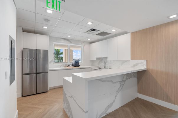 Interior, Kitchen, Marble Walls, Recessed Lighting, Stainless Steel Appliances, Wood Texture Flooring