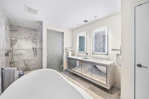 Bathroom, Dual Sink Vanities, Free Standing Baths, Glass Shower, Interior, Marble Walls, Recessed Lighting