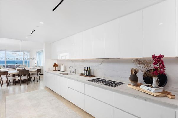 Dining room, Interior, Kitchen, Marble Walls, Pendant Lights, Recessed Lighting, Water, Wood Texture Flooring