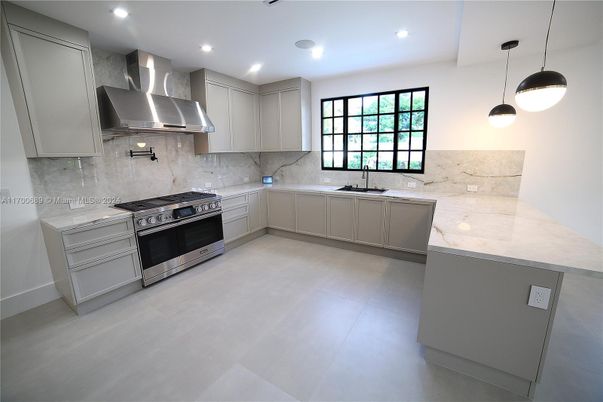 Interior, Kitchen, Marble Walls, Pendant Lights, Recessed Lighting, Stainless Steel Appliances